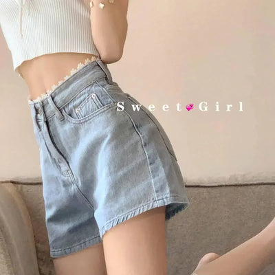 HIGH-WAISTED DENIM SHORTS IN LIGHT BLUE