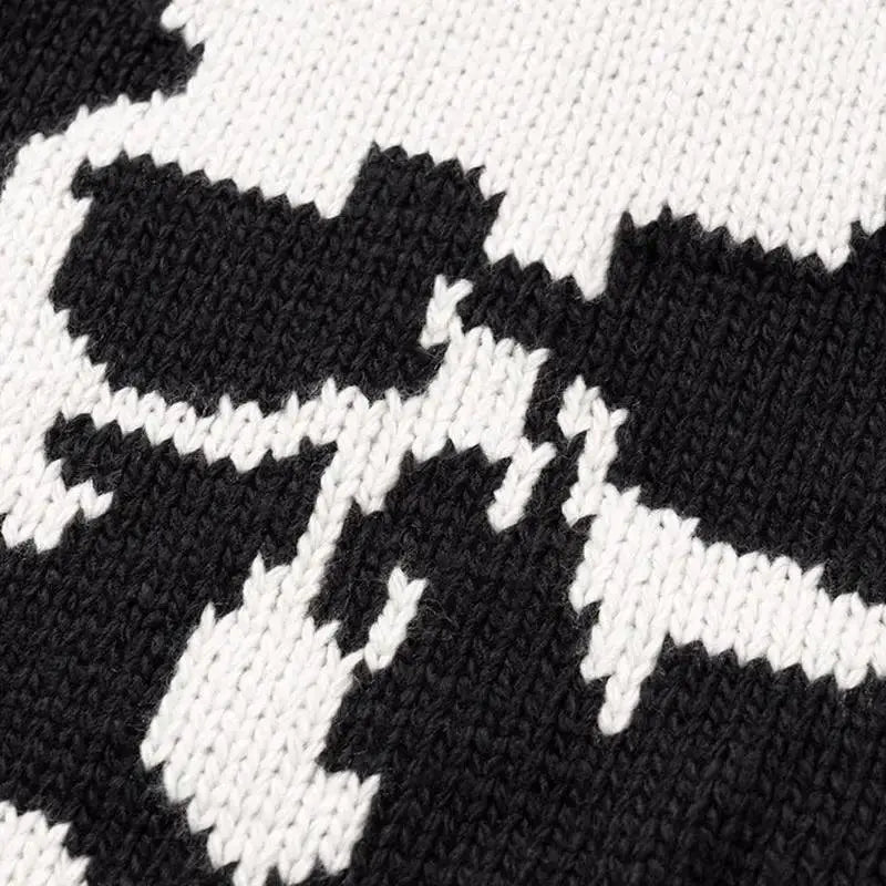KNITTED SWEATER WITH SKULL AND CROSSBONES PATTERN KNITTED