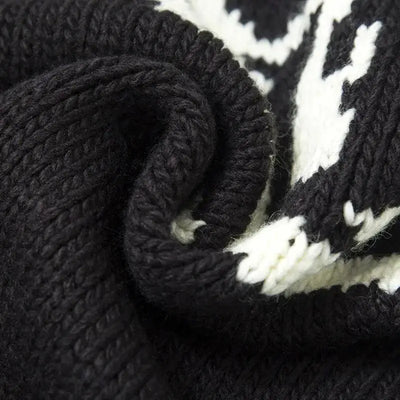 KNITTED SWEATER WITH SKULL AND CROSSBONES PATTERN KNITTED
