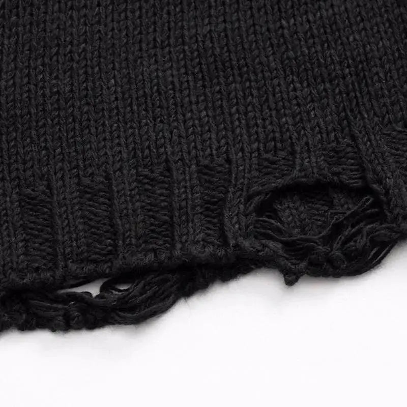 KNITTED SWEATER WITH SKULL AND CROSSBONES PATTERN KNITTED